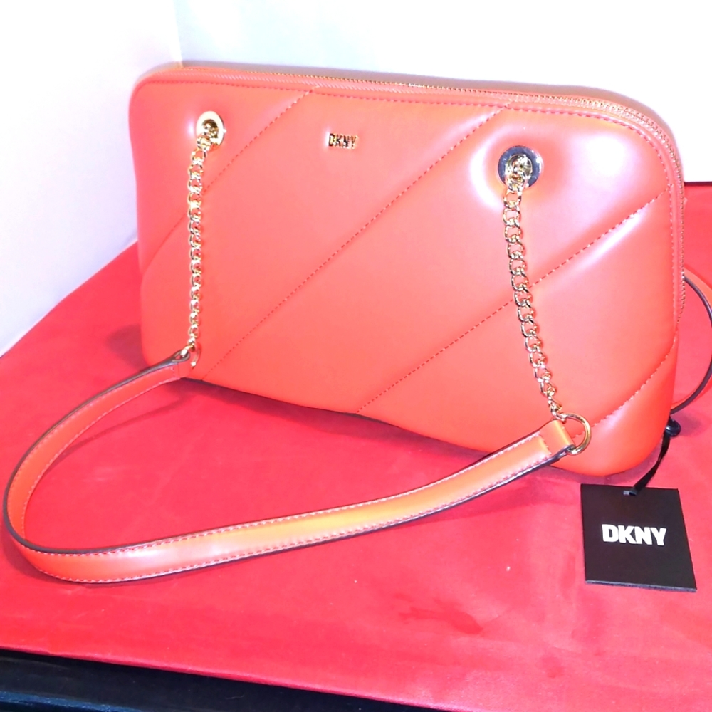 DKNY nice red and gold trim Saturn